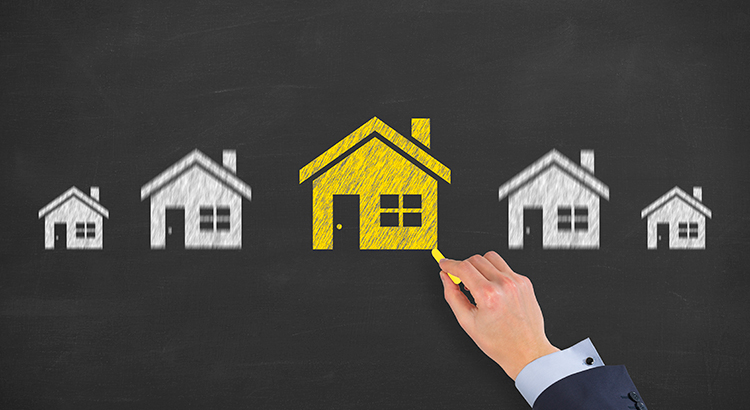 chalkboard with drawings of houses